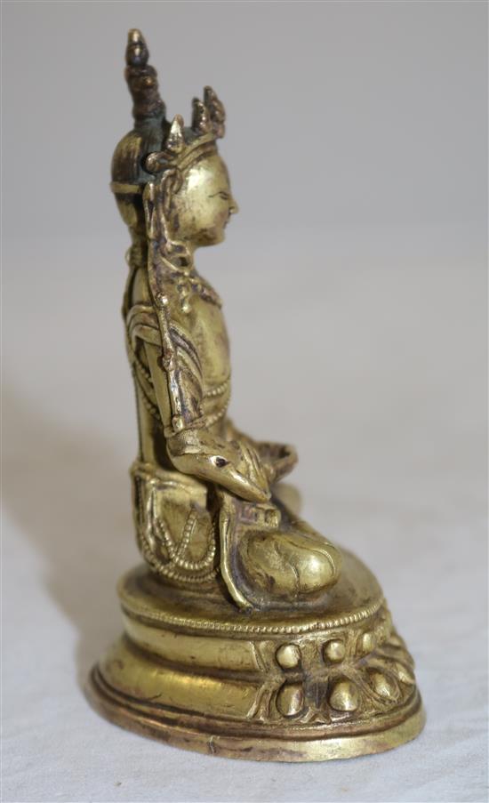 A small Tibetan gilt bronze seated figure of Amitayus, 18th/19th century, height 11cm